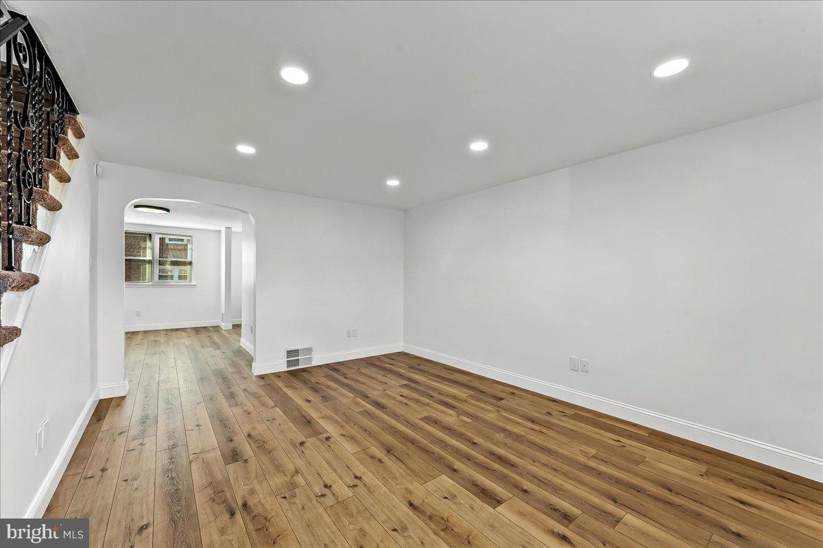 1232 Edgehill Road Darby, PA 19023 - Photo 3 of 20 an empty room with wooden floor and windows