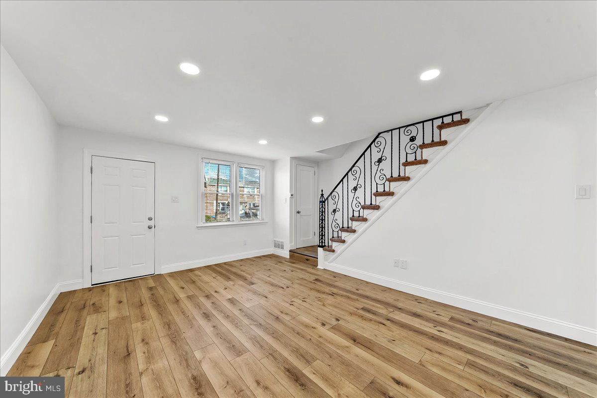 1232 Edgehill Road Darby, PA 19023 - Photo 5 of 20 a view of a big room with wooden floor and entryway