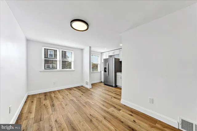 a view of a kitchen from the hallway