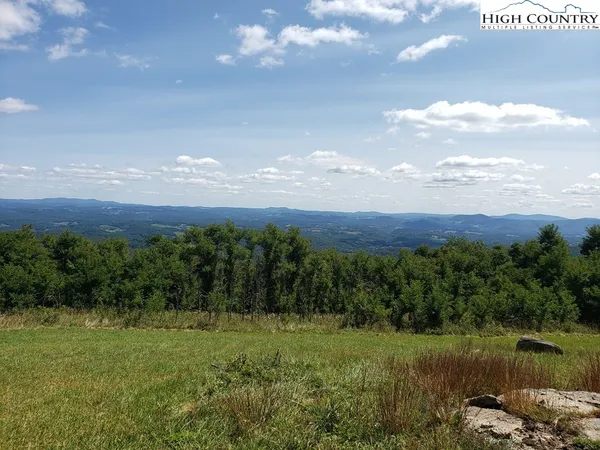 a view of a lake with outdoor space