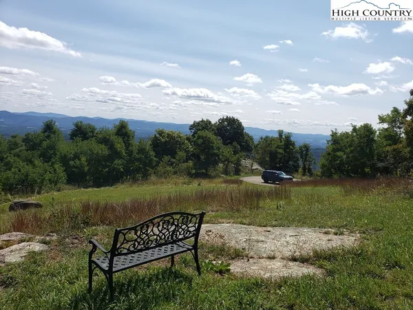 a view of a lake with a yard