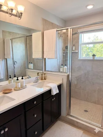 a view of bathroom sink and mirror