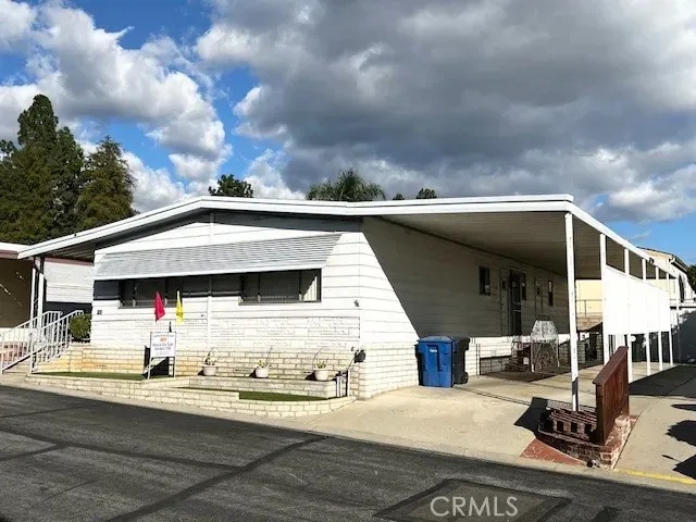 a view of a terrace with chairs and a table