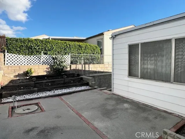 a view of a backyard with sitting area
