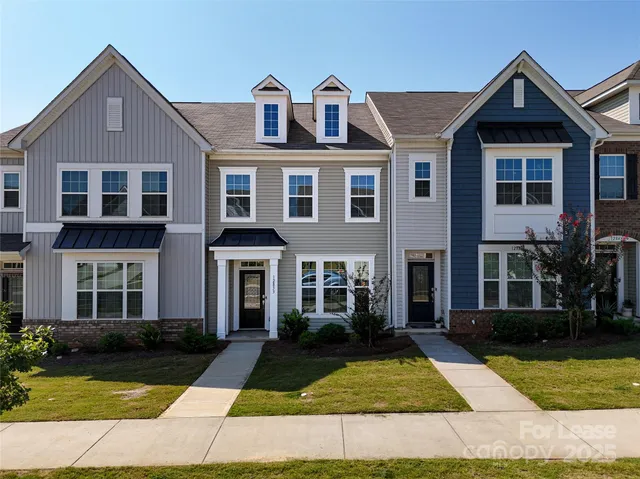 a front view of a house with yard