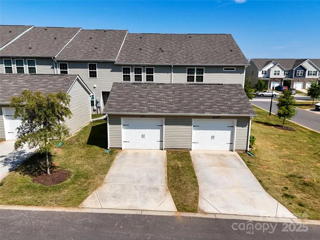 an aerial view of a house with swimming pool