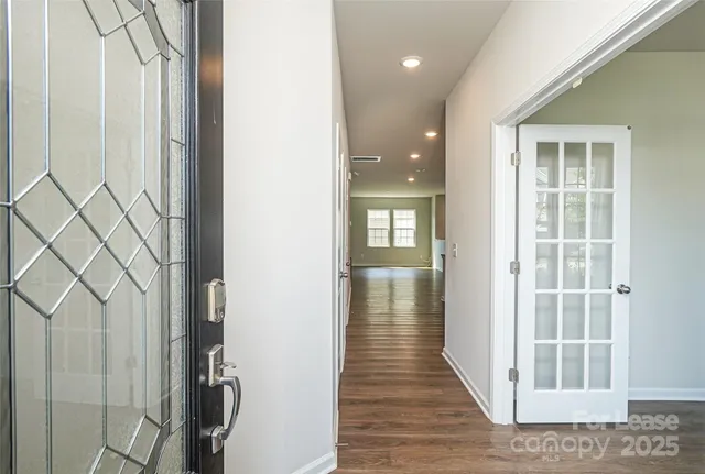 a view of entryway with wooden floor