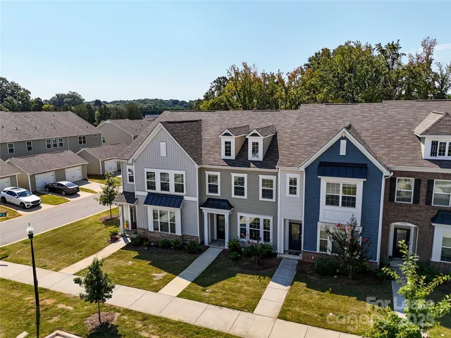 a aerial view of a house with street