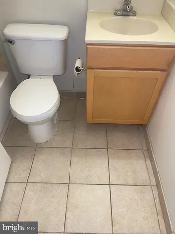 a bathroom with a toilet and a sink