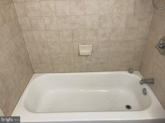 a bathroom with a bathtub