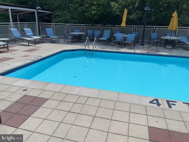 800 4th Street Southwest, Unit S503 Washington, DC 20024 - Photo 19 of 21 a view of a swimming pool with outdoor seating