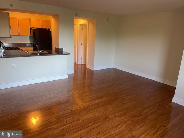 800 4th Street Southwest, Unit S503 Washington, DC 20024 - Photo 8 of 21 an empty room with wooden floor and windows
