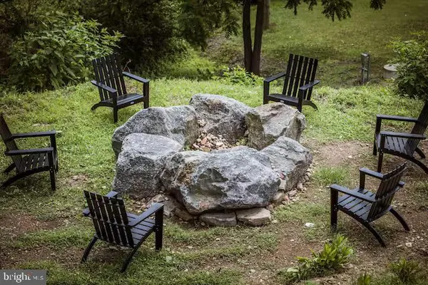 a view of a lake with a house in the background