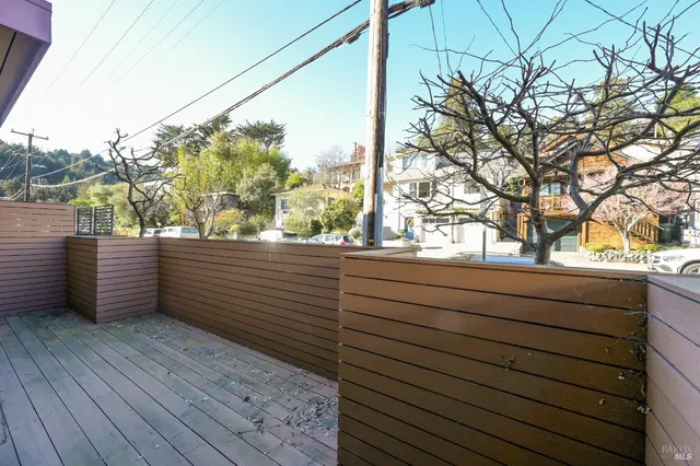 a view of a wooden deck with a bench