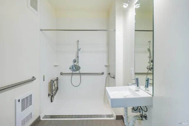 a bathroom with a sink and mirror
