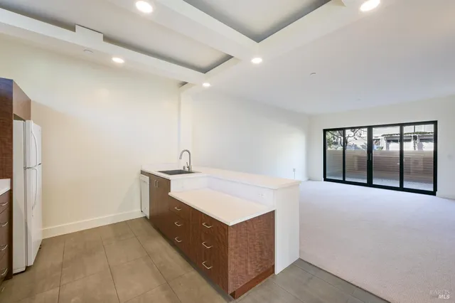 a room with a bed and a large window