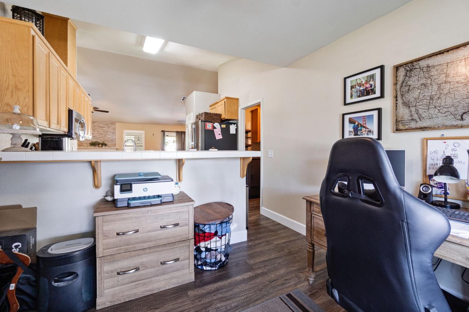 595 Quady Lane Madera, CA 93637 - Photo 15 of 25 a view of a workspace with furniture and a window