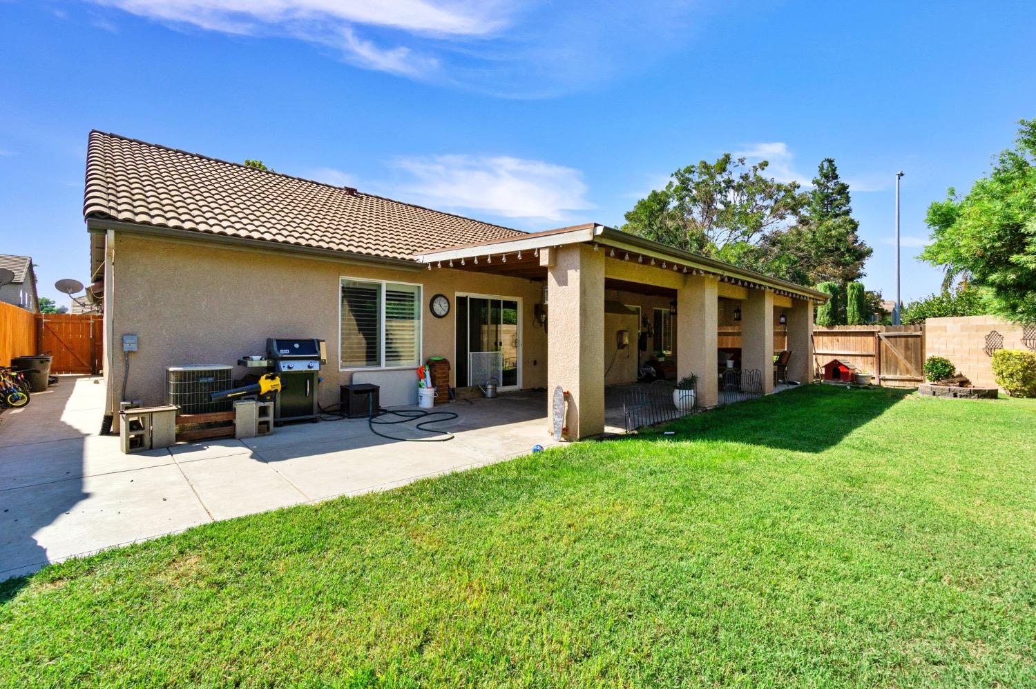 595 Quady Lane Madera, CA 93637 - Photo 24 of 25 a view of a house with backyard porch and sitting area
