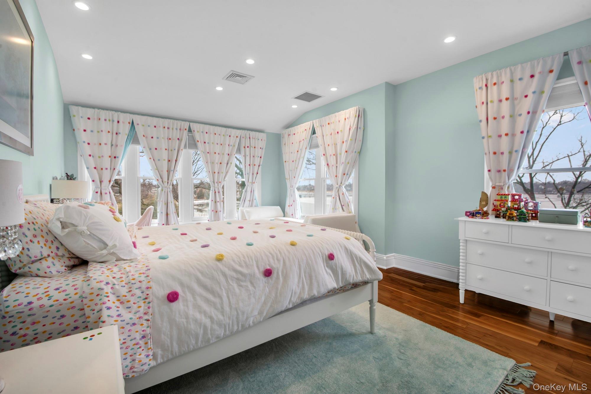 102 Shore Road Queens, NY 11363 - Photo 14 of 22 Bright corner bedroom with water views, wood-style floors and recessed lighting