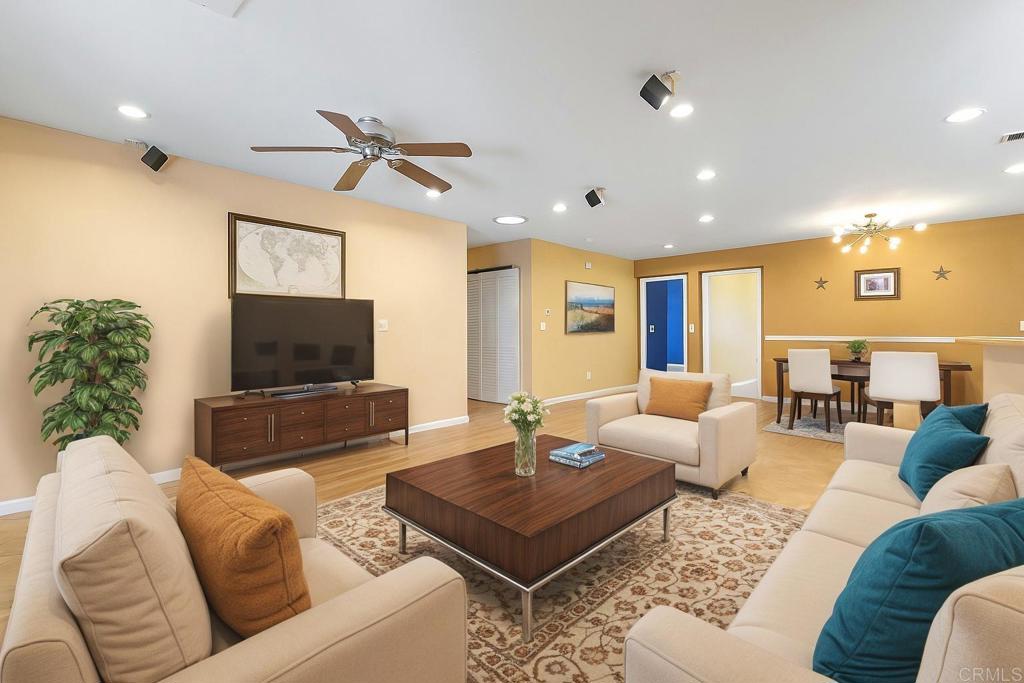 14429 Springvale Street Poway, CA 92064 - Photo 28 of 47 a living room with furniture a flat screen tv and a fireplace