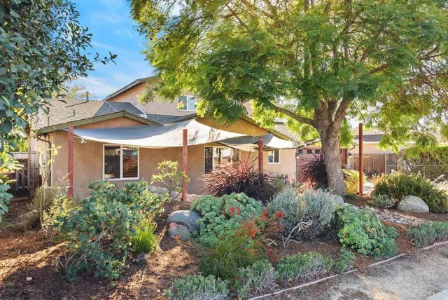 a view of an outdoor sitting area with brick walls