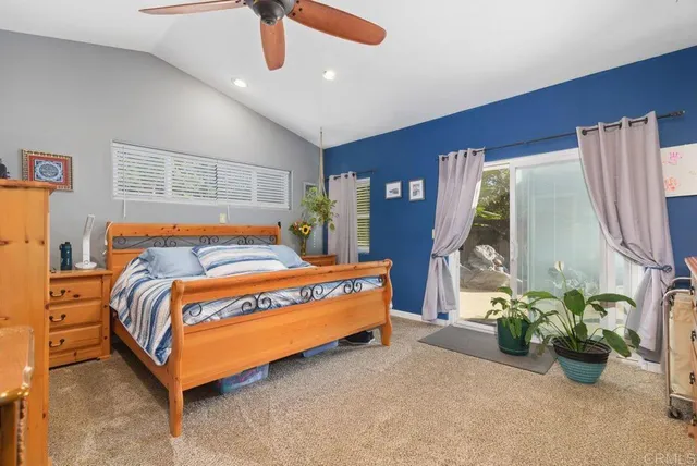 a bedroom with bed and window