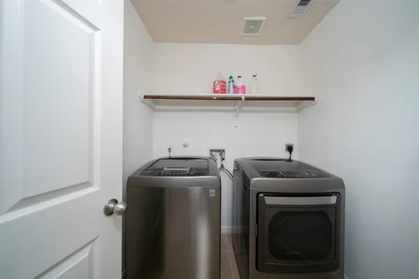 a view of an empty room with a fireplace