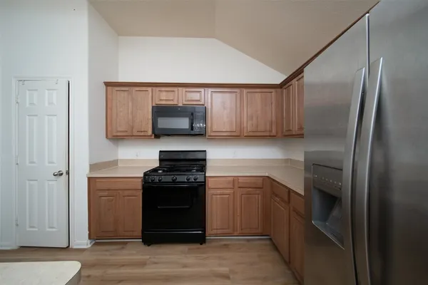 a kitchen with a sink and a stove top oven