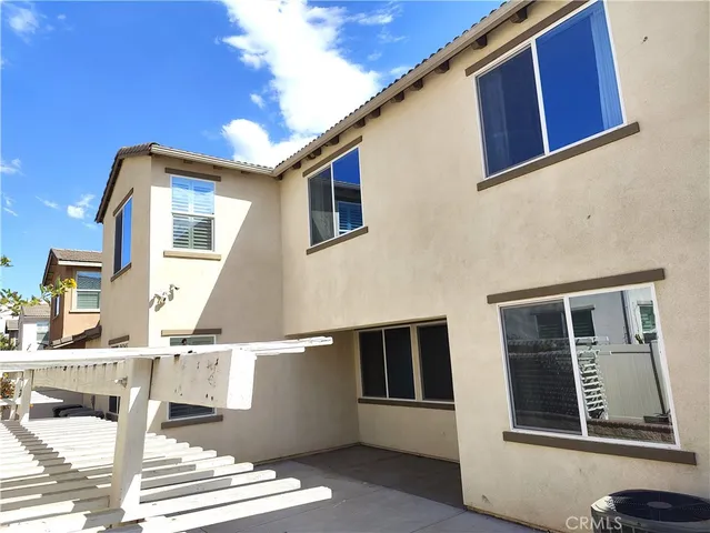 a view of wooden floor and windows in a room