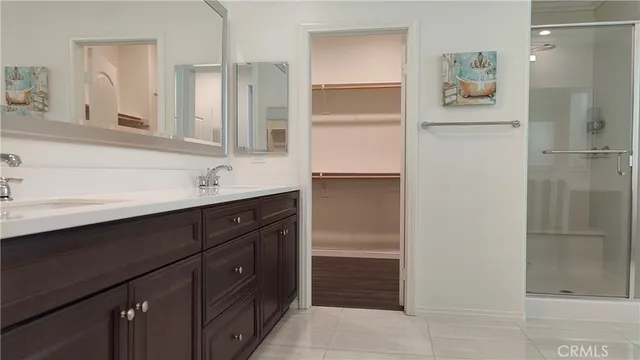 a white toilet sitting next to a bathroom sink