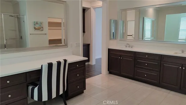 a sink with a mirror and vanity
