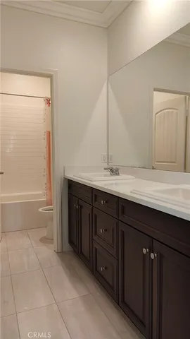 a view of wooden floor and windows in a room