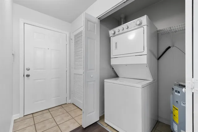 a view of storage and utility room with washer and dryer