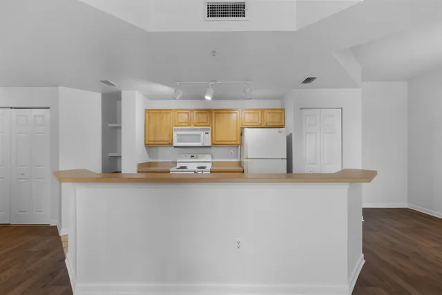 a kitchen with stainless steel appliances a sink and a window