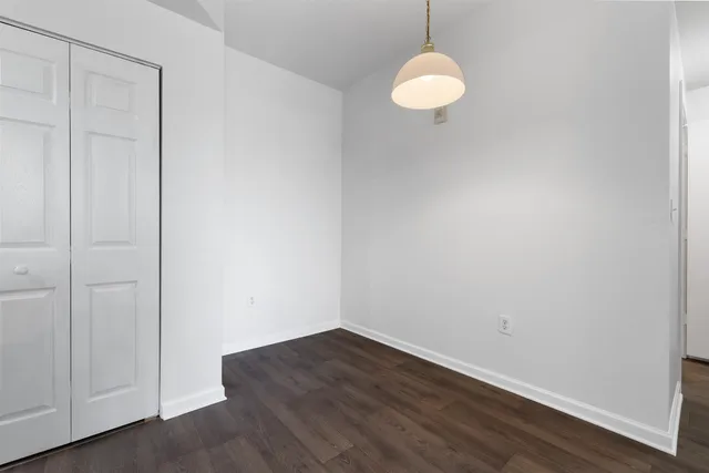 a view of a small space with wooden floor