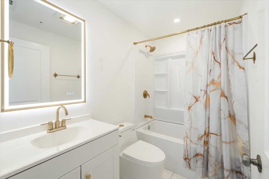 6 Bates Street, Unit A Devens, MA 01434 - Photo 34 of 41 a bathroom with a sink toilet tub and shower
