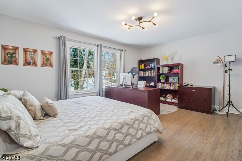 5 Farley Road Short Hills, NJ 07078 - Photo 16 of 26 a bedroom with a bed and a television