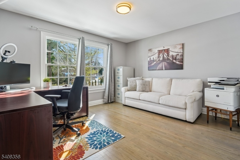 5 Farley Road Short Hills, NJ 07078 - Photo 18 of 26 a living room with furniture and a computer on the desk