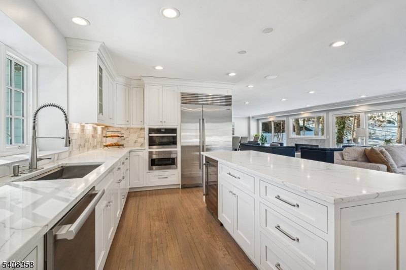 5 Farley Road Short Hills, NJ 07078 - Photo 6 of 26 a large kitchen with stainless steel appliances granite countertop a lot of counter space and wooden floor