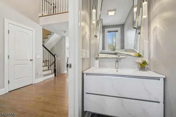 a bathroom with a sink and a mirror