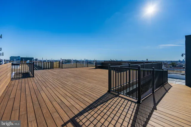 a view of balcony with wooden floor and city view