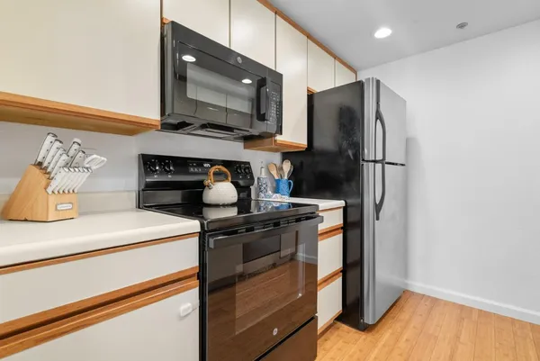 a view of a hallway with washer and dryer