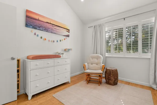 a bathroom with a toilet a sink and a mirror