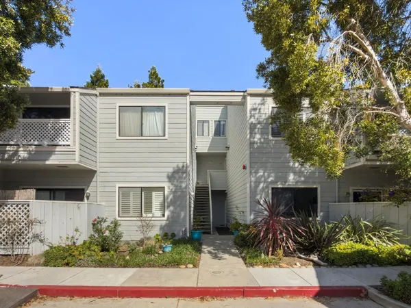 a living room with furniture flat screen tv and a fireplace