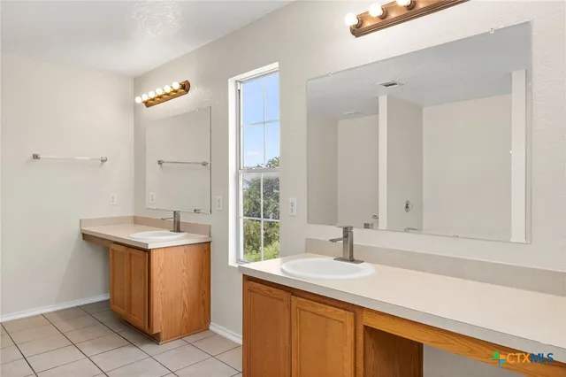 a kitchen with a sink and a window