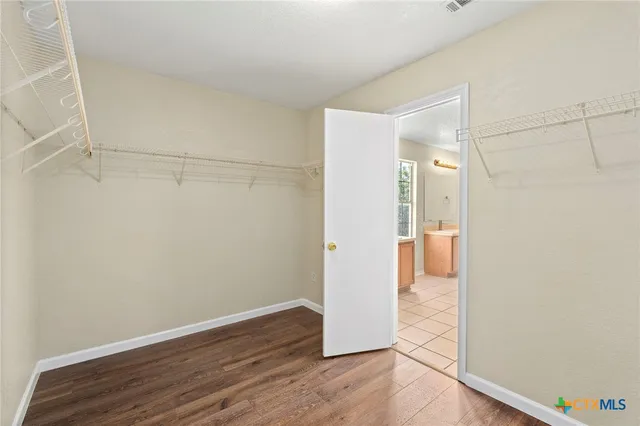 a view of a bathroom with wooden floor