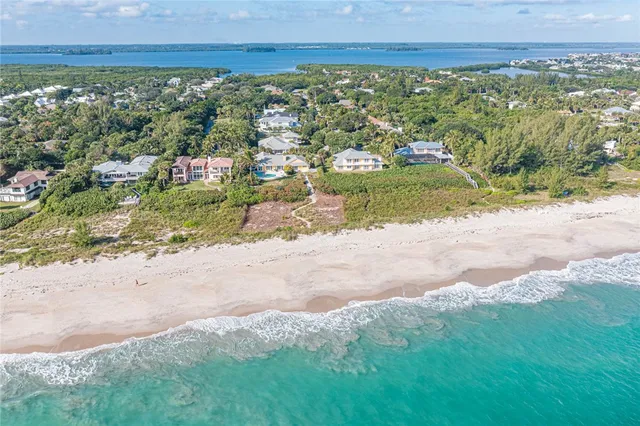 a view of a yard with an ocean view