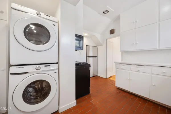 a view of a kitchen with washer and dryer