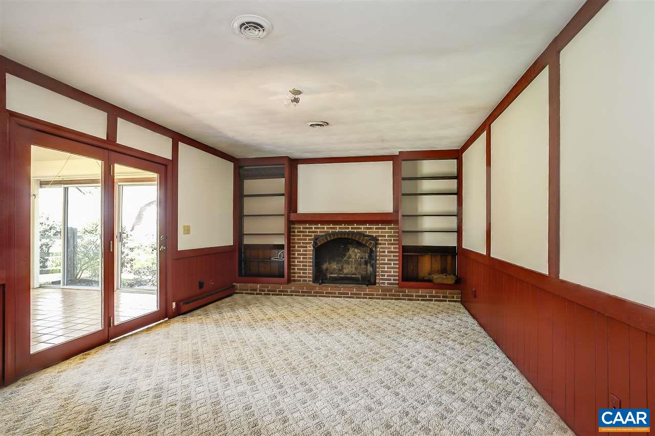 2711 Huntington Road Charlottesville, VA 22901 - Photo 15 of 39 a view of an empty room with a fireplace and a window