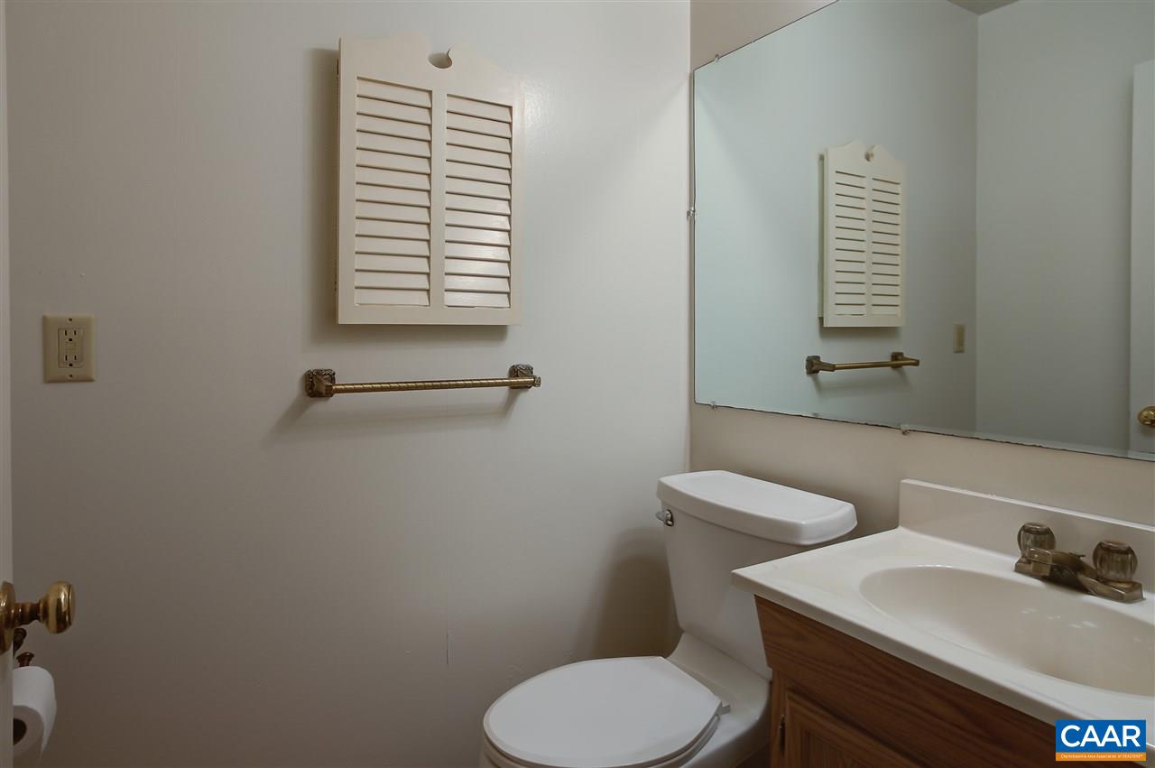 2711 Huntington Road Charlottesville, VA 22901 - Photo 19 of 39 a bathroom with a toilet sink and mirror